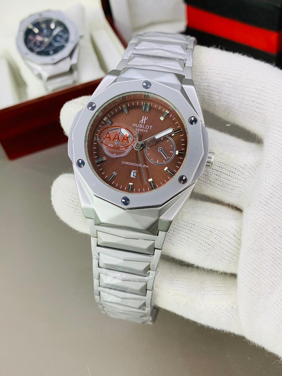 Hublot Big Bang Chronograph Watch Featuring a Metallic Silver Case and Brown Dial